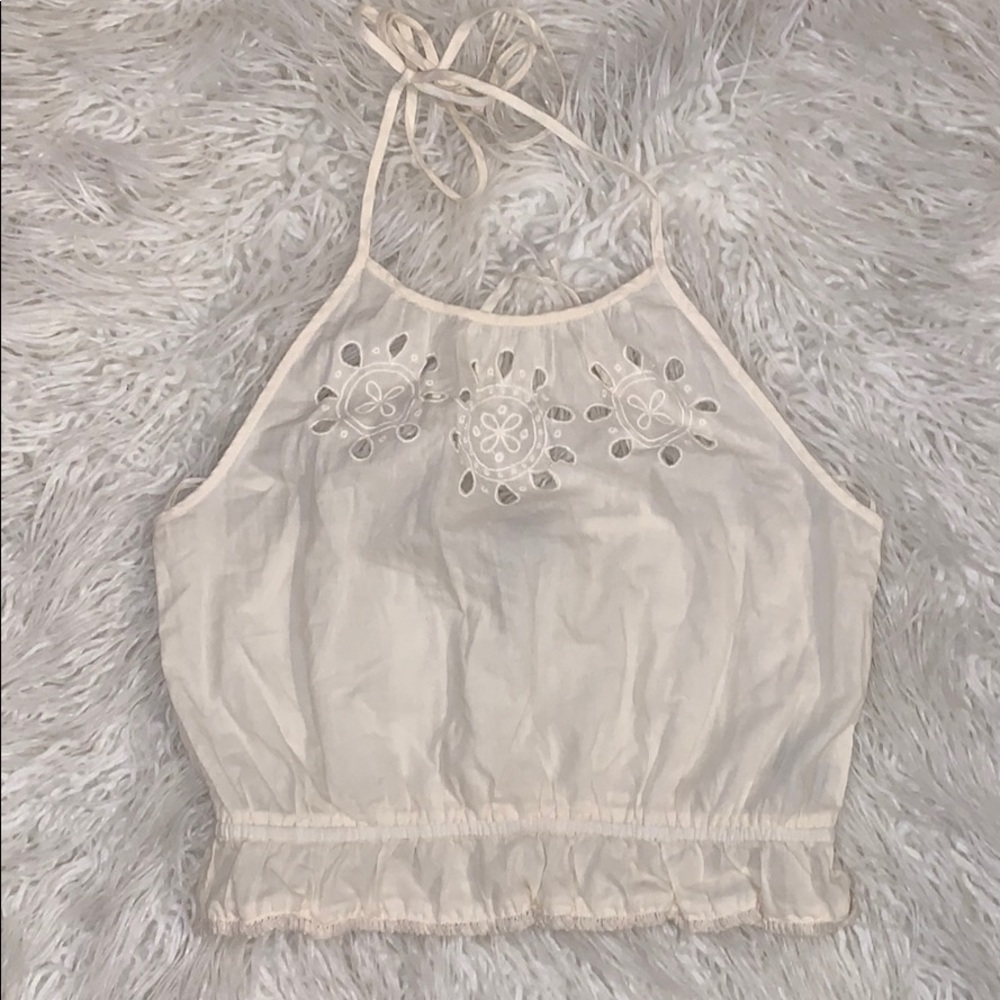 Open back creamy white colored halter top